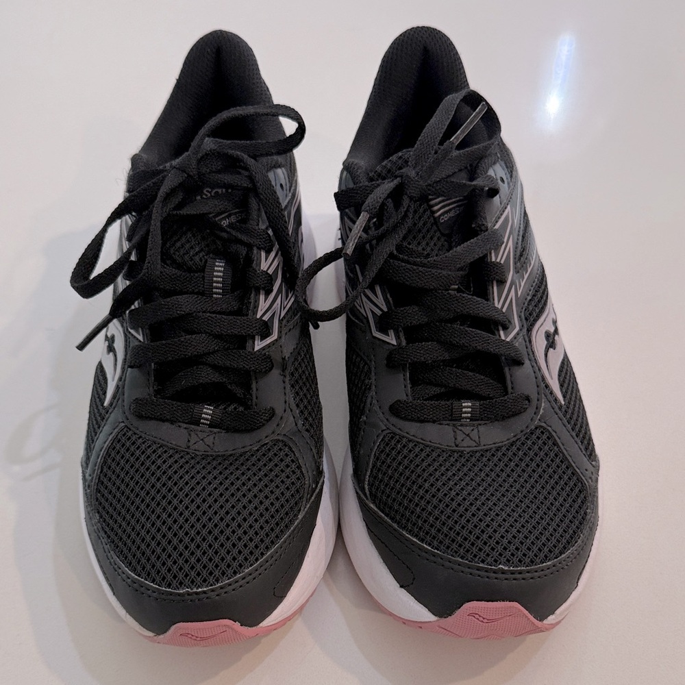 Saucony Cohesion 14 running shoes in black with pink accents. Size 9.5